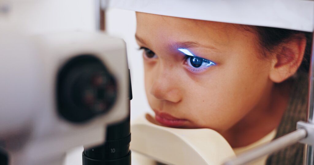 Health, kid or eye care examination with ophthalmoscope for retina assessment or ocular wellness. P